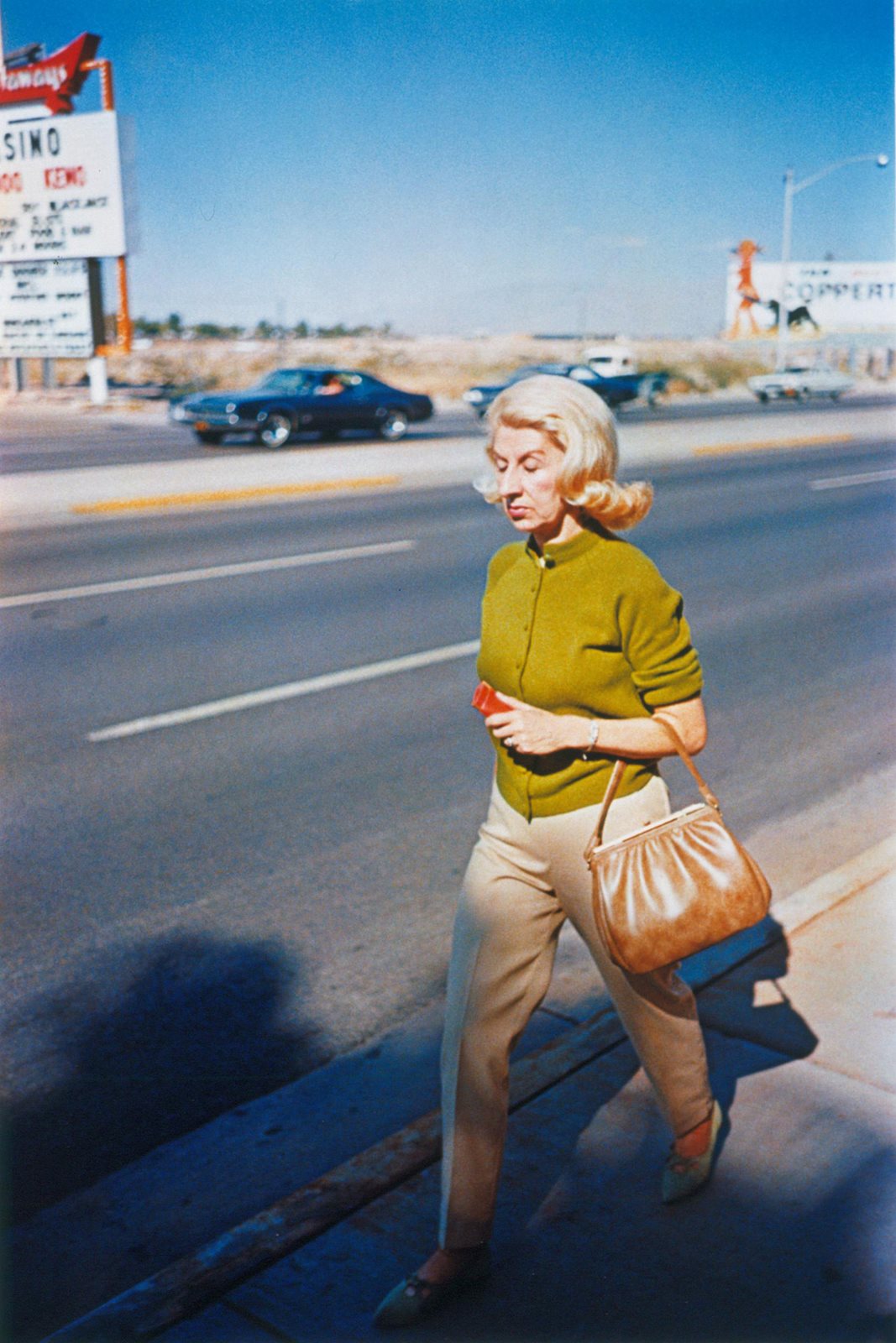 Dust Bells 2 – Woman Walking on Sidewalk