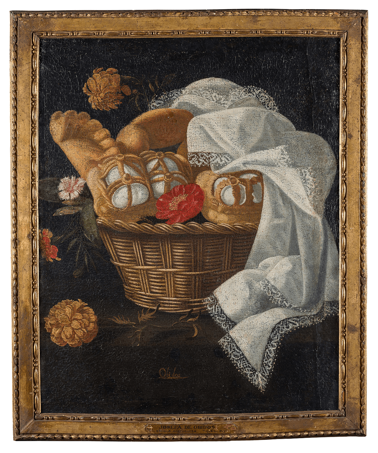 Still life with Easter cakes basket, flowers and embroidered clothes